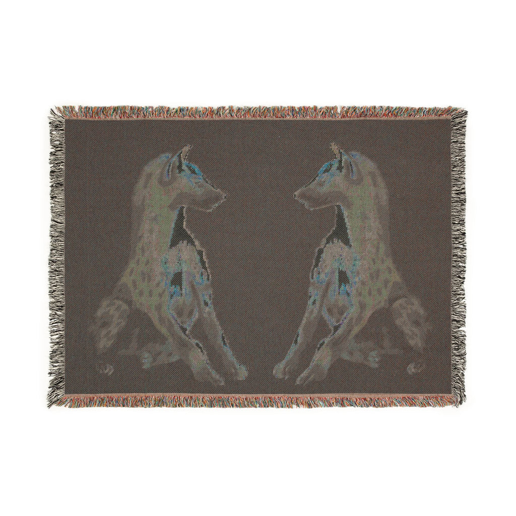 Woven blanket featuring illustrated hyena pups in a cozy wildlife-inspired design with warm earthy tones and detailed animal artwork. Soft statement blanket with nature lover aesthetic, safari inspired decor, whimsical wildlife art, maximalist home decor, indie illustration style, cozy cottagecore vibe, and expressive alternative decor perfect for bedrooms, reading nooks, couches, gifts, and colorful eclectic living spaces.