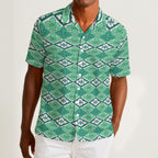 Button-down shirt featuring the Bloomgrid in Mint Mojito pattern with mint green, cream, and citrus-toned geometric floral shapes in a retro-inspired all-over print. Lightweight summer button down with coastal resort aesthetic, vintage Palm Springs style, botanical geometric pattern, maximalist fashion, indie streetwear, colorful vacation outfit, mod inspired design, artsy casualwear, breezy resortwear, expressive fashion, queer friendly style, and playful retro clothing perfect for beach vacations, brunch,