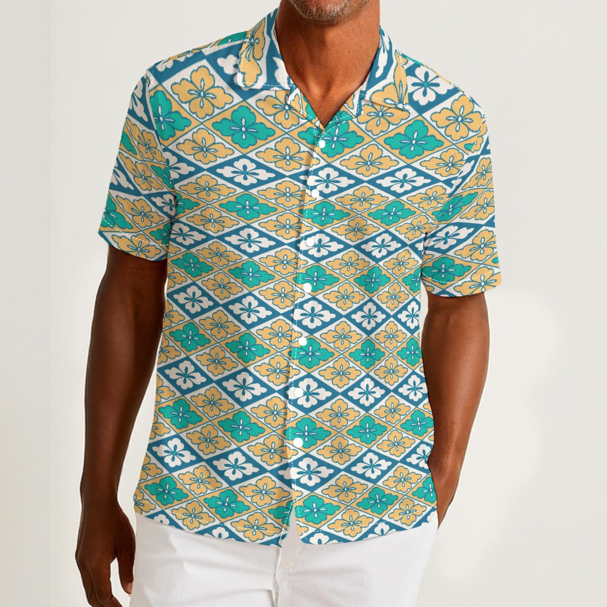 Button-down shirt featuring the Bloomgrid in Capri Coast pattern, with a blue coastal floral grid design and all-over print. Lightweight casual shirt with retro resort style, beach vacation fashion, botanical pattern, geometric floral print, artsy summer outfit, coastal grandma aesthetic, indie fashion, colorful resortwear, short sleeve statement shirt, vacation button down, breezy warm weather clothing, and unique patterned apparel for beach days, brunch, travel, festivals, and everyday summer wear.