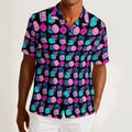 Button-down shirt featuring a colorful polyhedral dice pattern in an all-over tabletop gaming inspired print. Lightweight statement shirt with nerdy maximalist aesthetic, tabletop RPG fashion, Dungeons and Dragons inspired style, indie streetwear, expressive queer friendly fashion, whimsical gamer apparel, retro novelty print, artsy casualwear, and playful alternative clothing perfect for conventions, game nights, festivals, vacations, and everyday geek fashion.