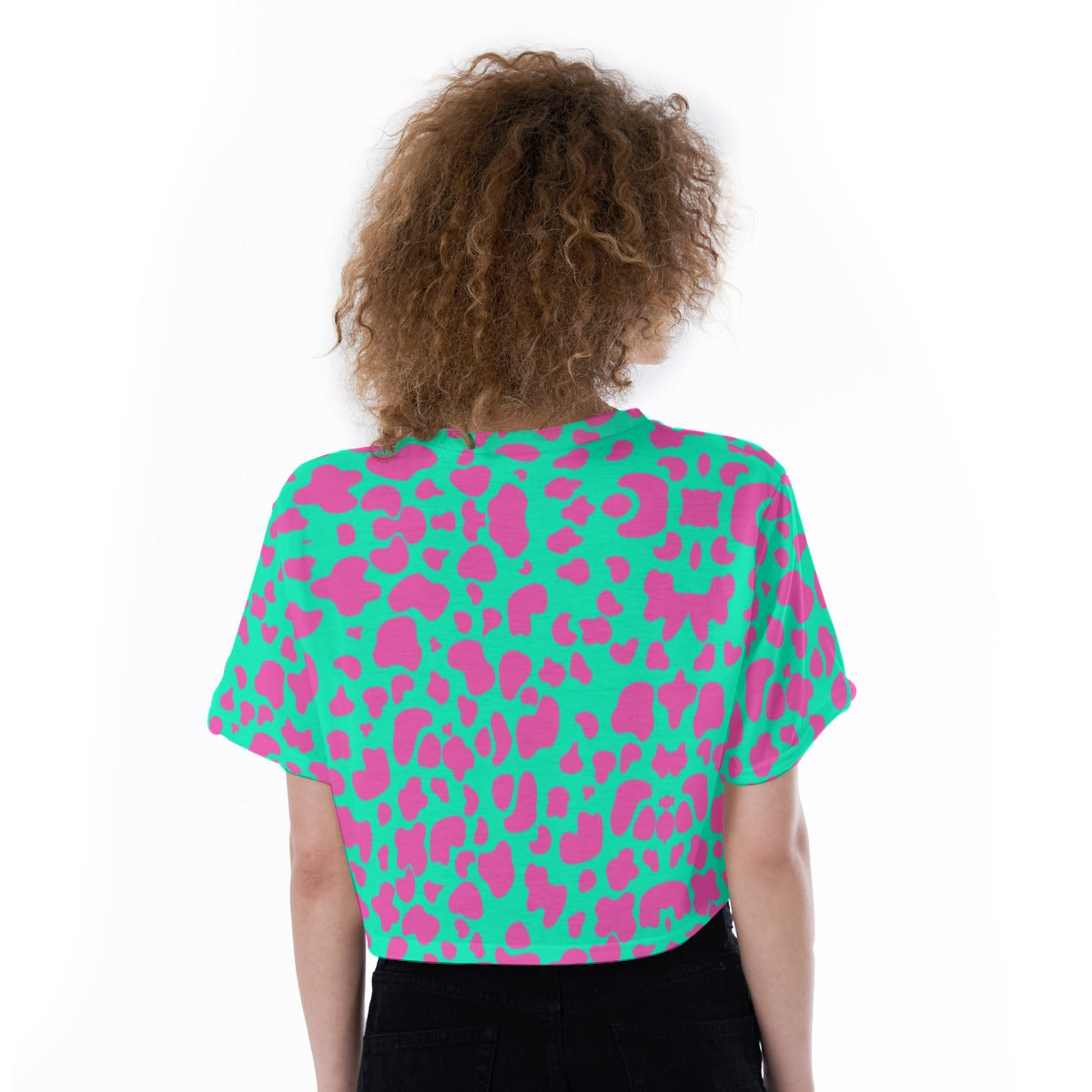 Crop top featuring a pink bubblegum cow print with playful western-inspired all-over pattern design. Alternative fashion crop top with coquette cowgirl aesthetic, kawaii western style, Y2K inspired fashion, cute indie streetwear, whimsical cow print apparel, girly statement clothing, pastel western fashion, playful maximalist aesthetic, expressive queer friendly style, and trendy alternative crop top perfect for festivals, concerts, casual outings, summer outfits, vacations, and fun everyday wear.