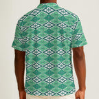 Button-down shirt featuring the Bloomgrid in Mint Mojito pattern with mint green, cream, and citrus-toned geometric floral shapes in a retro-inspired all-over print. Lightweight summer button down with coastal resort aesthetic, vintage Palm Springs style, botanical geometric pattern, maximalist fashion, indie streetwear, colorful vacation outfit, mod inspired design, artsy casualwear, breezy resortwear, expressive fashion, queer friendly style, and playful retro clothing perfect for beach vacations, brunch,