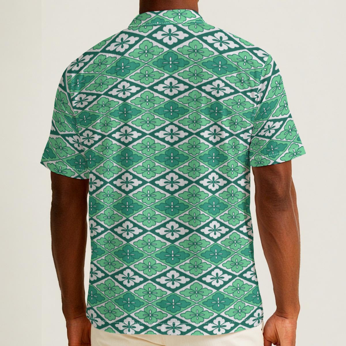 Button-down shirt featuring the Bloomgrid in Mint Mojito pattern with mint green, cream, and citrus-toned geometric floral shapes in a retro-inspired all-over print. Lightweight summer button down with coastal resort aesthetic, vintage Palm Springs style, botanical geometric pattern, maximalist fashion, indie streetwear, colorful vacation outfit, mod inspired design, artsy casualwear, breezy resortwear, expressive fashion, queer friendly style, and playful retro clothing perfect for beach vacations, brunch,