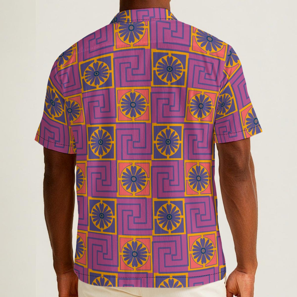 Button-down shirt featuring the Petal Circuit in Disco Fig pattern with bold purple, pink, orange, and cream geometric floral shapes in a retro-inspired all-over print. Lightweight statement shirt with maximalist fashion aesthetic, vintage resort style, mod inspired pattern, psychedelic floral design, indie streetwear, colorful vacation outfit vibe, expressive queer friendly fashion, artsy casualwear, retro geometric clothing, playful summer button down, and breezy resortwear perfect for festivals, travel