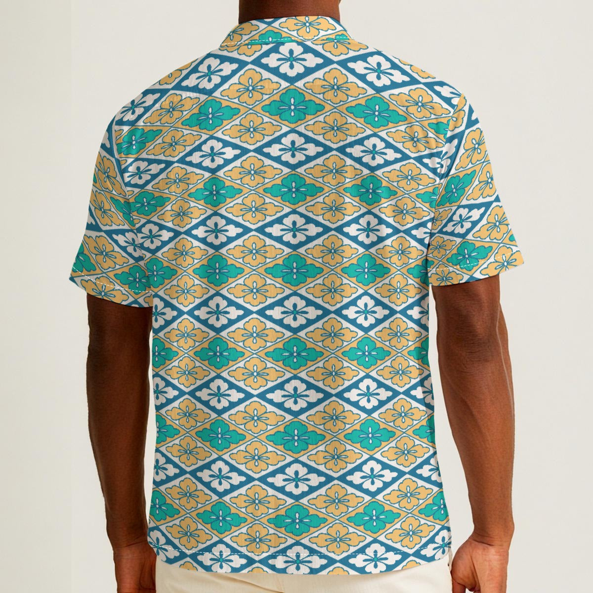 Button-down shirt featuring the Bloomgrid in Capri Coast pattern, with a blue coastal floral grid design and all-over print. Lightweight casual shirt with retro resort style, beach vacation fashion, botanical pattern, geometric floral print, artsy summer outfit, coastal grandma aesthetic, indie fashion, colorful resortwear, short sleeve statement shirt, vacation button down, breezy warm weather clothing, and unique patterned apparel for beach days, brunch, travel, festivals, and everyday summer wear.