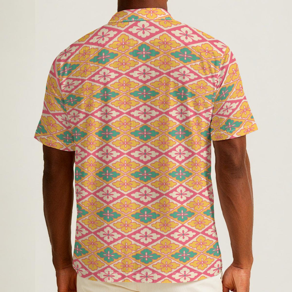 Button-down shirt featuring the Bloomgrid in Candy Cabana pattern with vibrant pink, coral, cream, and mint geometric floral shapes in a playful retro-inspired all-over print. Lightweight summer button down with maximalist fashion aesthetic, vintage resort style, tropical vacation outfit vibe, Palm Springs inspired design, colorful geometric floral pattern, indie fashion, artsy streetwear, mod inspired clothing, expressive queer friendly fashion, retro beachwear, statement summer shirt, and breezy resortwea