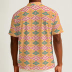 Button-down shirt featuring the Bloomgrid in Candy Cabana pattern with vibrant pink, coral, cream, and mint geometric floral shapes in a playful retro-inspired all-over print. Lightweight summer button down with maximalist fashion aesthetic, vintage resort style, tropical vacation outfit vibe, Palm Springs inspired design, colorful geometric floral pattern, indie fashion, artsy streetwear, mod inspired clothing, expressive queer friendly fashion, retro beachwear, statement summer shirt, and breezy resortwea
