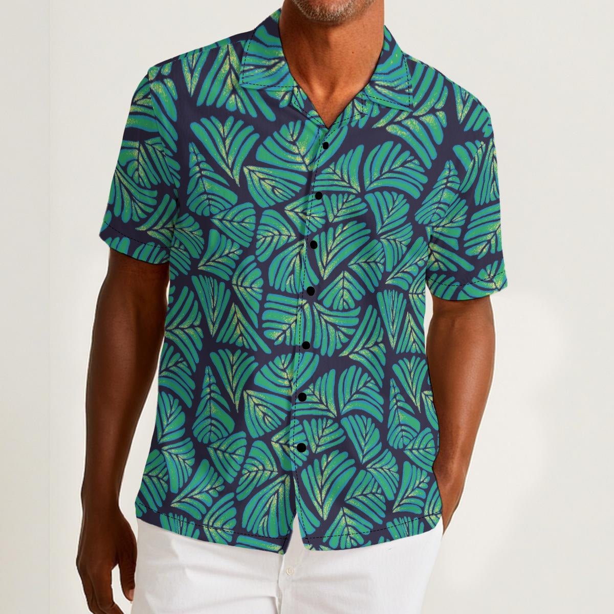 Button-down shirt featuring the Frondescence pattern with layered tropical foliage in deep green botanical tones and an all-over nature-inspired print. Lightweight summer shirt with lush jungle aesthetic, maximalist fashion, indie streetwear, botanical artwork, earthy resort style, expressive queer friendly fashion, artsy casualwear, and retro-inspired tropical clothing perfect for vacations, festivals, brunch, beach trips, and everyday alternative wear.
