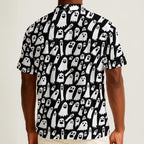 Button-down shirt featuring a playful black-and-white ghost pattern in an all-over spooky print design. Lightweight summer shirt with spooky cute aesthetic, vintage Halloween style, alternative fashion, indie streetwear, whimsical ghost artwork, expressive queer friendly fashion, retro novelty print, artsy casualwear, and statement resortwear perfect for festivals, concerts, Halloween parties, vacations, brunch, and everyday alternative wear.