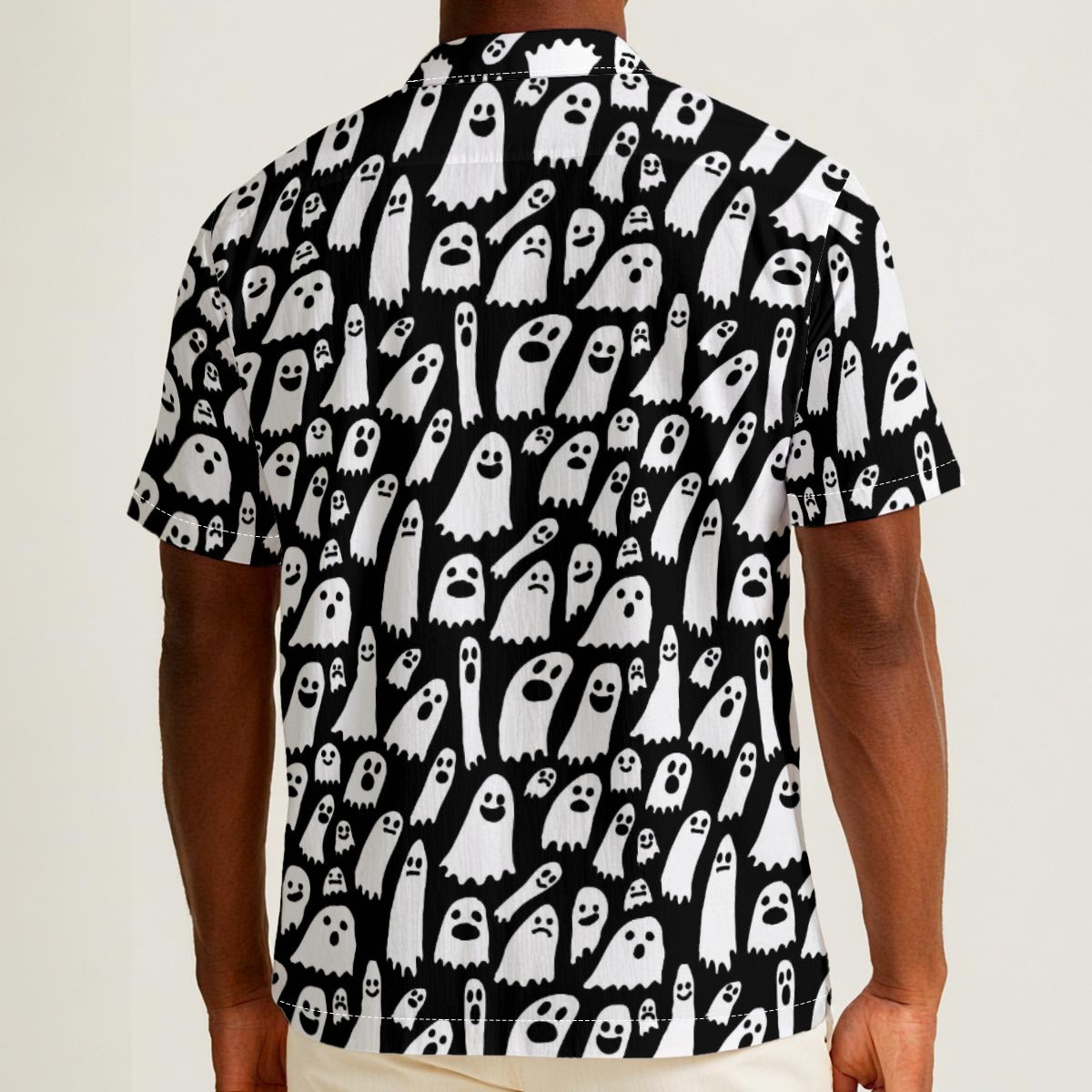 Button-down shirt featuring a playful black-and-white ghost pattern in an all-over spooky print design. Lightweight summer shirt with spooky cute aesthetic, vintage Halloween style, alternative fashion, indie streetwear, whimsical ghost artwork, expressive queer friendly fashion, retro novelty print, artsy casualwear, and statement resortwear perfect for festivals, concerts, Halloween parties, vacations, brunch, and everyday alternative wear.