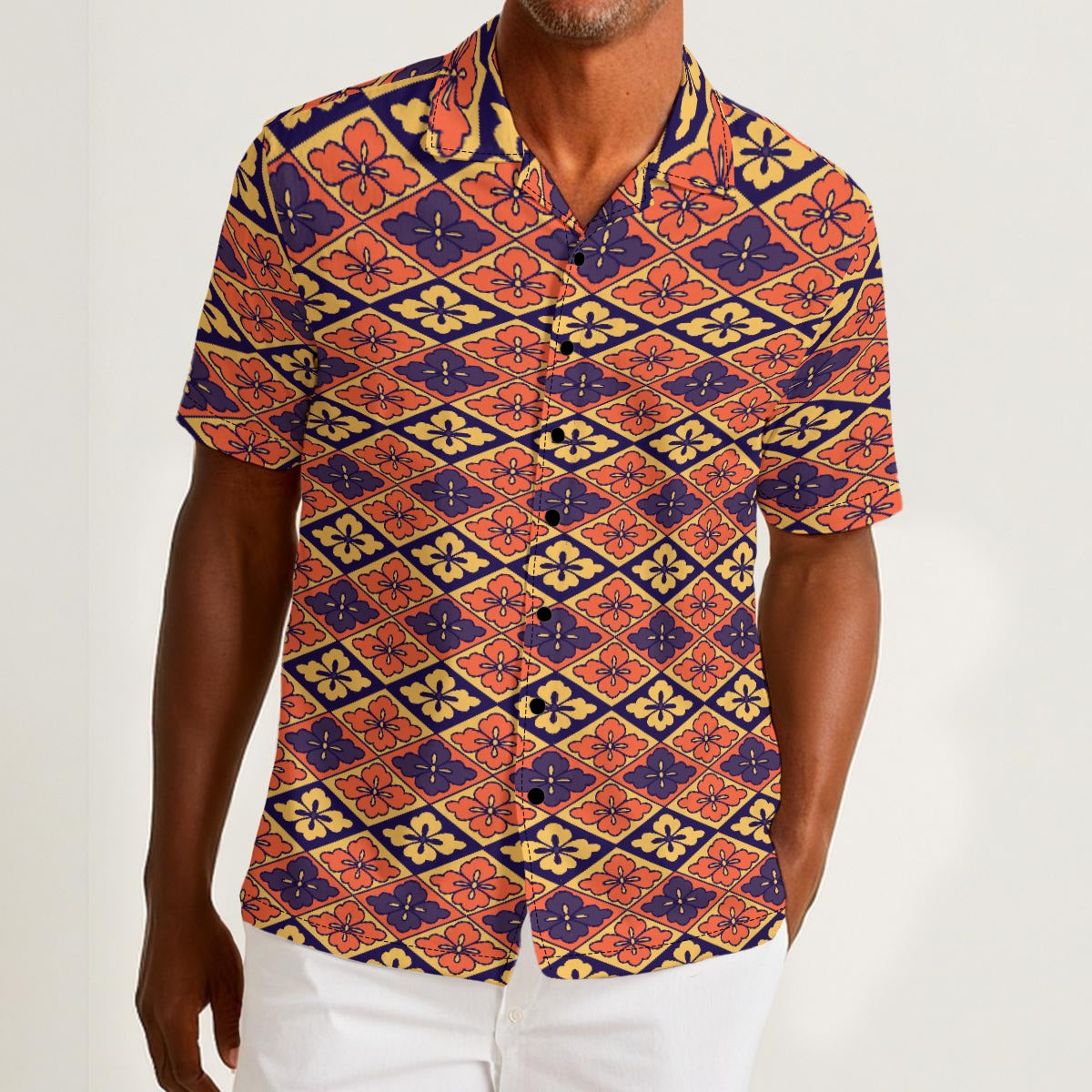 Button-down shirt featuring the Bloomgrid in Disco Dahlia pattern with vibrant pink, orange, and cream geometric floral shapes in a retro-inspired all-over print. Colorful statement shirt with maximalist fashion aesthetic, vintage resort style, mod inspired pattern, artsy streetwear, retro floral design, indie fashion, bold vacation outfit, short sleeve summer button down, playful geometric print, expressive fashion, queer friendly style, and lightweight resortwear perfect for festivals, travel, beach vacat