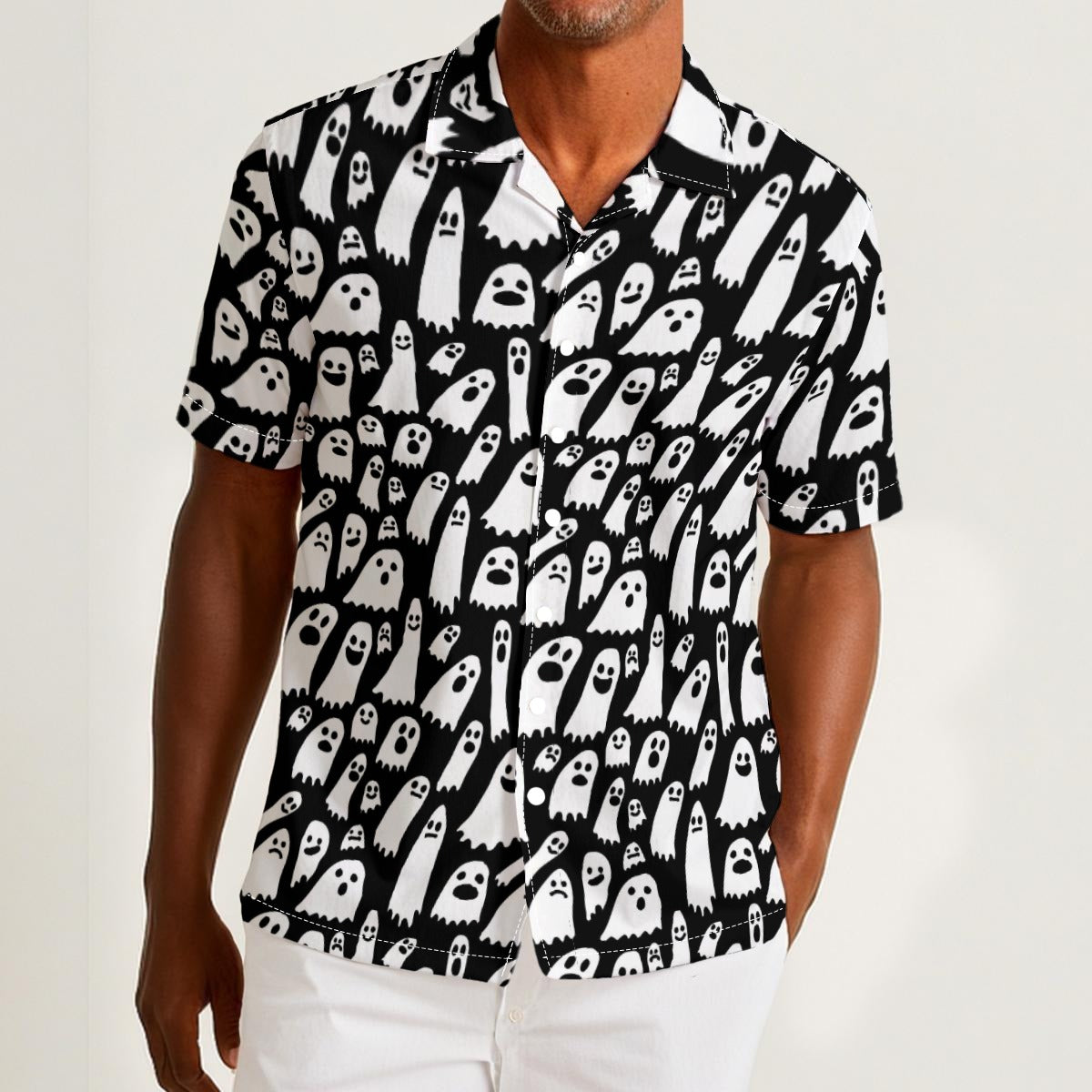 Button-down shirt featuring a playful black-and-white ghost pattern in an all-over spooky print design. Lightweight summer shirt with spooky cute aesthetic, vintage Halloween style, alternative fashion, indie streetwear, whimsical ghost artwork, expressive queer friendly fashion, retro novelty print, artsy casualwear, and statement resortwear perfect for festivals, concerts, Halloween parties, vacations, brunch, and everyday alternative wear.