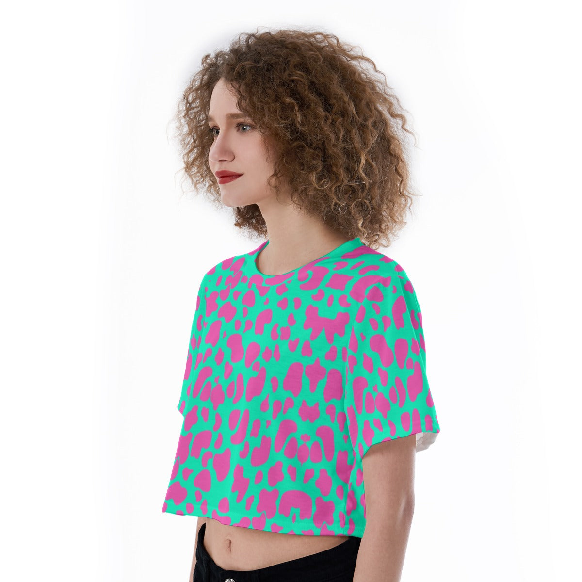 Crop top featuring a pink bubblegum cow print with playful western-inspired all-over pattern design. Alternative fashion crop top with coquette cowgirl aesthetic, kawaii western style, Y2K inspired fashion, cute indie streetwear, whimsical cow print apparel, girly statement clothing, pastel western fashion, playful maximalist aesthetic, expressive queer friendly style, and trendy alternative crop top perfect for festivals, concerts, casual outings, summer outfits, vacations, and fun everyday wear.