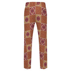 Dress pants featuring the Petal Circuit in Mulled Spice pattern with warm rust, plum, cream, and golden geometric floral shapes in a retro-inspired all-over print. Statement trousers with vintage autumn aesthetic, maximalist fashion, indie streetwear, mod inspired design, expressive queer friendly style, artsy alternative clothing, colorful geometric pattern, and bold patterned pants perfect for concerts, festivals, creative workwear, nightlife, parties, and everyday alternative fashion.