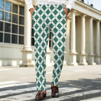Dress pants featuring the Fleur Riviera in Sea Glass pattern with ornate floral motifs in soft teal, cream, and seafoam tones in a vintage-inspired all-over print. Statement trousers with coastal maximalist aesthetic, indie streetwear, botanical artwork, expressive queer friendly fashion, retro resort style, artsy alternative clothing, and colorful patterned pants perfect for festivals, creative workwear, brunch, vacations, concerts, and everyday alternative fashion.