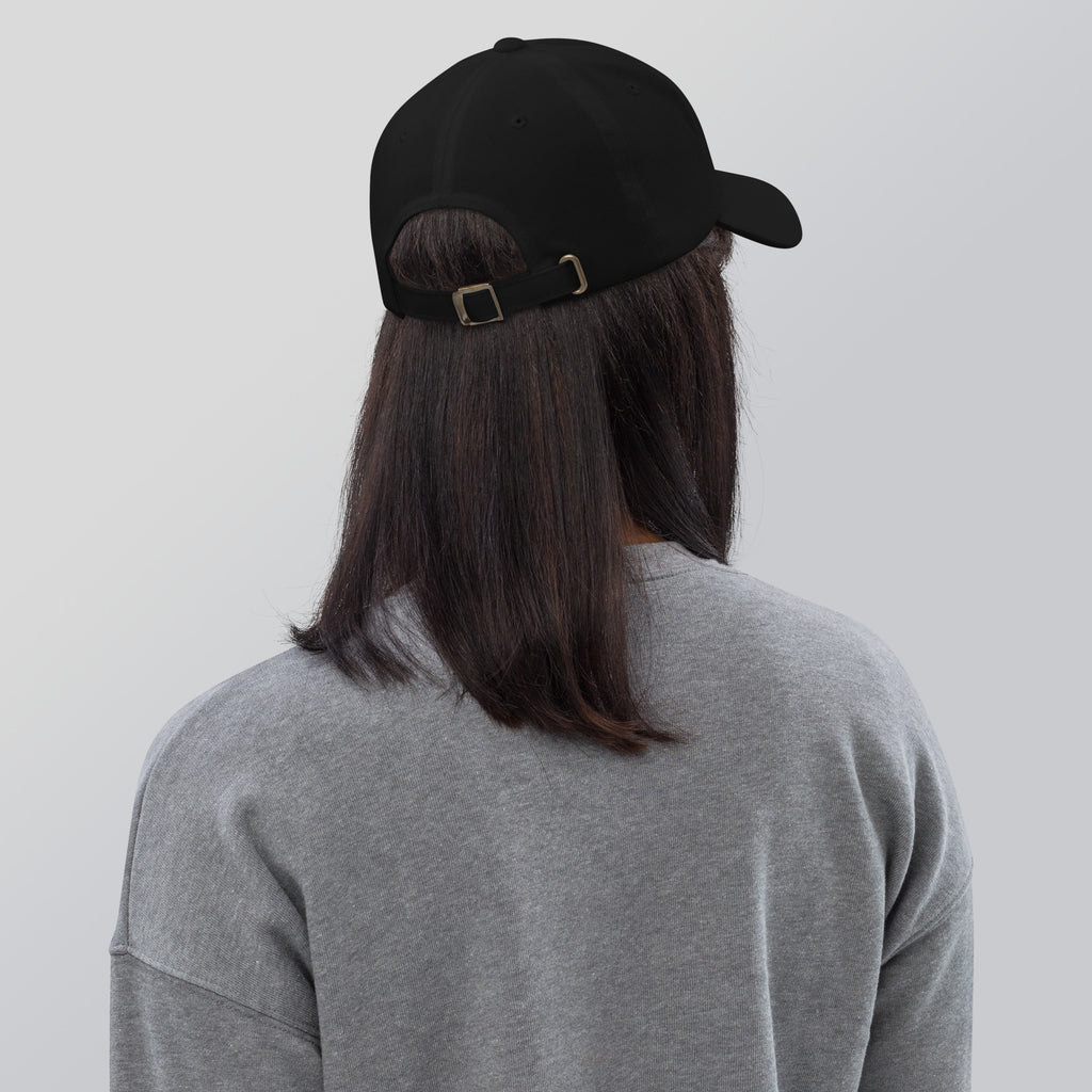 Black dad hat embroidered with the word ‘HAG’ in ornate vintage gothic lettering. Alternative fashion accessory with queer streetwear aesthetic, witchy fashion, sarcastic humor, feminist style, indie fashion, spooky cute apparel, gothic embroidery, punk inspired streetwear, adjustable baseball cap, casual everyday alternative outfit, internet humor fashion, artsy accessory, and edgy statement hat for concerts, festivals, casual wear, and alternative wardrobes.