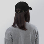 Black dad hat embroidered with the word ‘HAG’ in ornate vintage gothic lettering. Alternative fashion accessory with queer streetwear aesthetic, witchy fashion, sarcastic humor, feminist style, indie fashion, spooky cute apparel, gothic embroidery, punk inspired streetwear, adjustable baseball cap, casual everyday alternative outfit, internet humor fashion, artsy accessory, and edgy statement hat for concerts, festivals, casual wear, and alternative wardrobes.