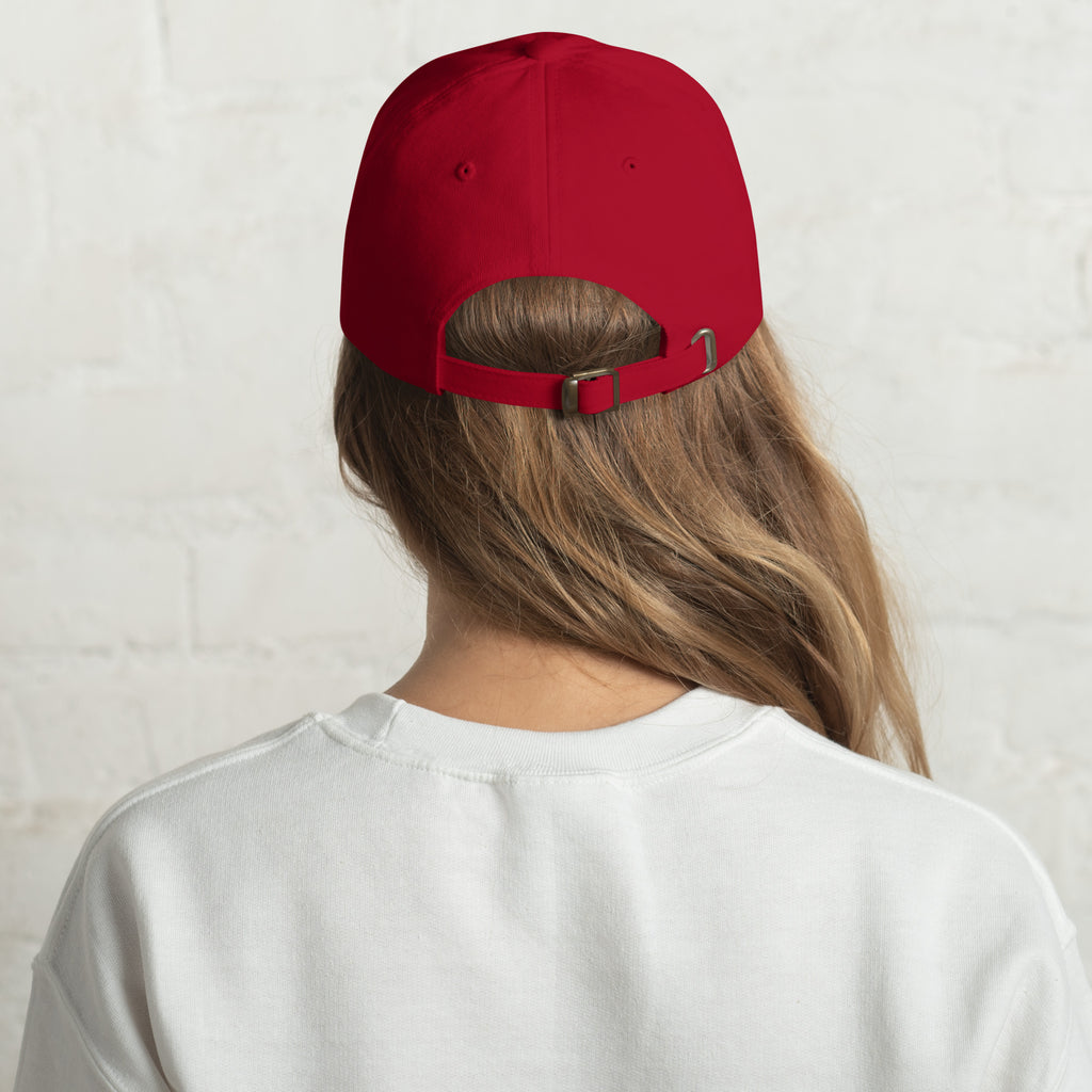 Baseball cap embroidered with the phrase ‘I Have a Cigarette in All 7 Holes’ in ornate vintage gothic lettering. Alternative fashion accessory with edgy internet humor, queer streetwear aesthetic, punk inspired style, ironic meme fashion, tattoo inspired typography, goth streetwear, adjustable dad hat, casual alternative outfit accessory, artsy statement cap, chaotic humor apparel, indie fashion, and expressive alternative clothing for concerts, festivals, everyday wear, and alternative wardrobes.