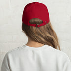 Baseball cap embroidered with the phrase ‘I Have a Cigarette in All 7 Holes’ in ornate vintage gothic lettering. Alternative fashion accessory with edgy internet humor, queer streetwear aesthetic, punk inspired style, ironic meme fashion, tattoo inspired typography, goth streetwear, adjustable dad hat, casual alternative outfit accessory, artsy statement cap, chaotic humor apparel, indie fashion, and expressive alternative clothing for concerts, festivals, everyday wear, and alternative wardrobes.