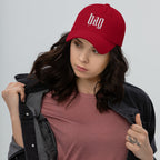 Black dad hat embroidered with the word ‘HAG’ in ornate vintage gothic lettering. Alternative fashion accessory with queer streetwear aesthetic, witchy fashion, sarcastic humor, feminist style, indie fashion, spooky cute apparel, gothic embroidery, punk inspired streetwear, adjustable baseball cap, casual everyday alternative outfit, internet humor fashion, artsy accessory, and edgy statement hat for concerts, festivals, casual wear, and alternative wardrobes.