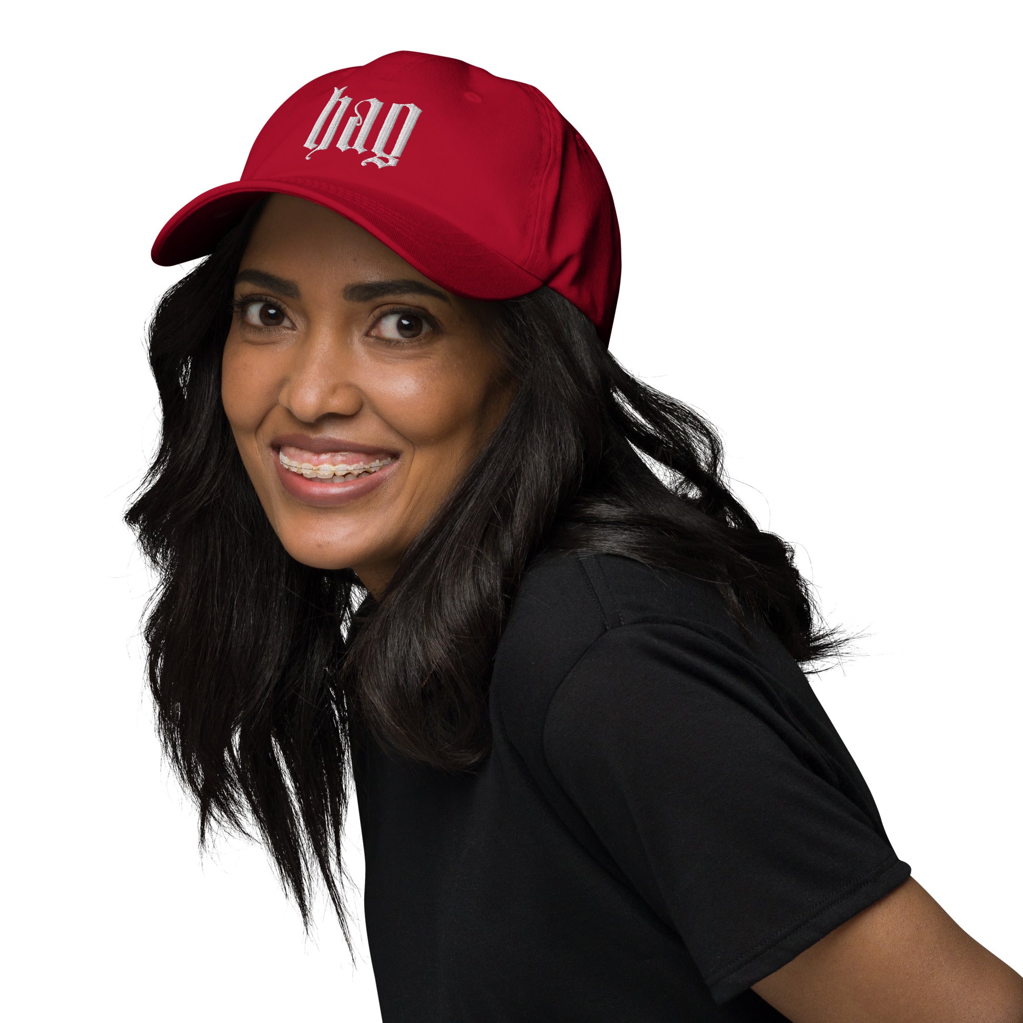 Black dad hat embroidered with the word ‘HAG’ in ornate vintage gothic lettering. Alternative fashion accessory with queer streetwear aesthetic, witchy fashion, sarcastic humor, feminist style, indie fashion, spooky cute apparel, gothic embroidery, punk inspired streetwear, adjustable baseball cap, casual everyday alternative outfit, internet humor fashion, artsy accessory, and edgy statement hat for concerts, festivals, casual wear, and alternative wardrobes.