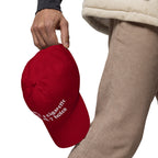 Baseball cap embroidered with the phrase ‘I Have a Cigarette in All 7 Holes’ in ornate vintage gothic lettering. Alternative fashion accessory with edgy internet humor, queer streetwear aesthetic, punk inspired style, ironic meme fashion, tattoo inspired typography, goth streetwear, adjustable dad hat, casual alternative outfit accessory, artsy statement cap, chaotic humor apparel, indie fashion, and expressive alternative clothing for concerts, festivals, everyday wear, and alternative wardrobes.