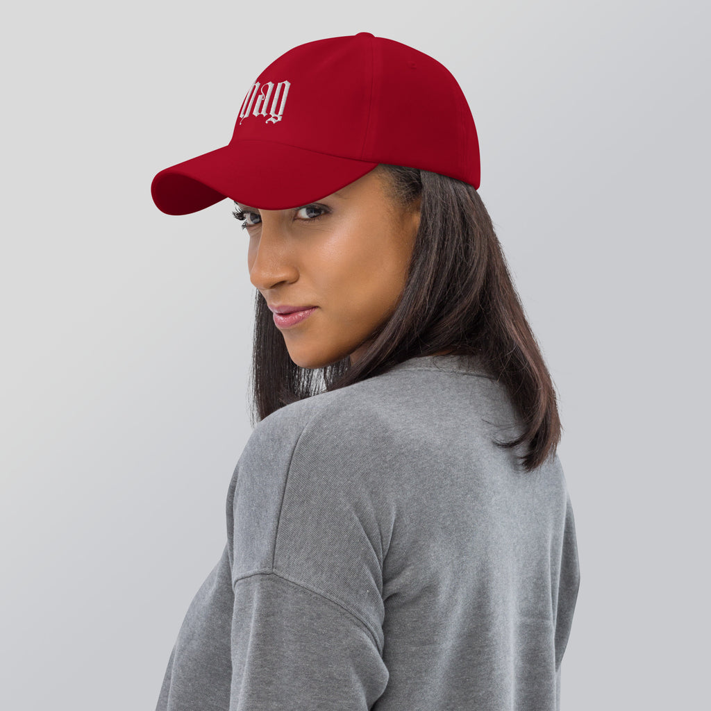 Black dad hat embroidered with the word ‘HAG’ in ornate vintage gothic lettering. Alternative fashion accessory with queer streetwear aesthetic, witchy fashion, sarcastic humor, feminist style, indie fashion, spooky cute apparel, gothic embroidery, punk inspired streetwear, adjustable baseball cap, casual everyday alternative outfit, internet humor fashion, artsy accessory, and edgy statement hat for concerts, festivals, casual wear, and alternative wardrobes.