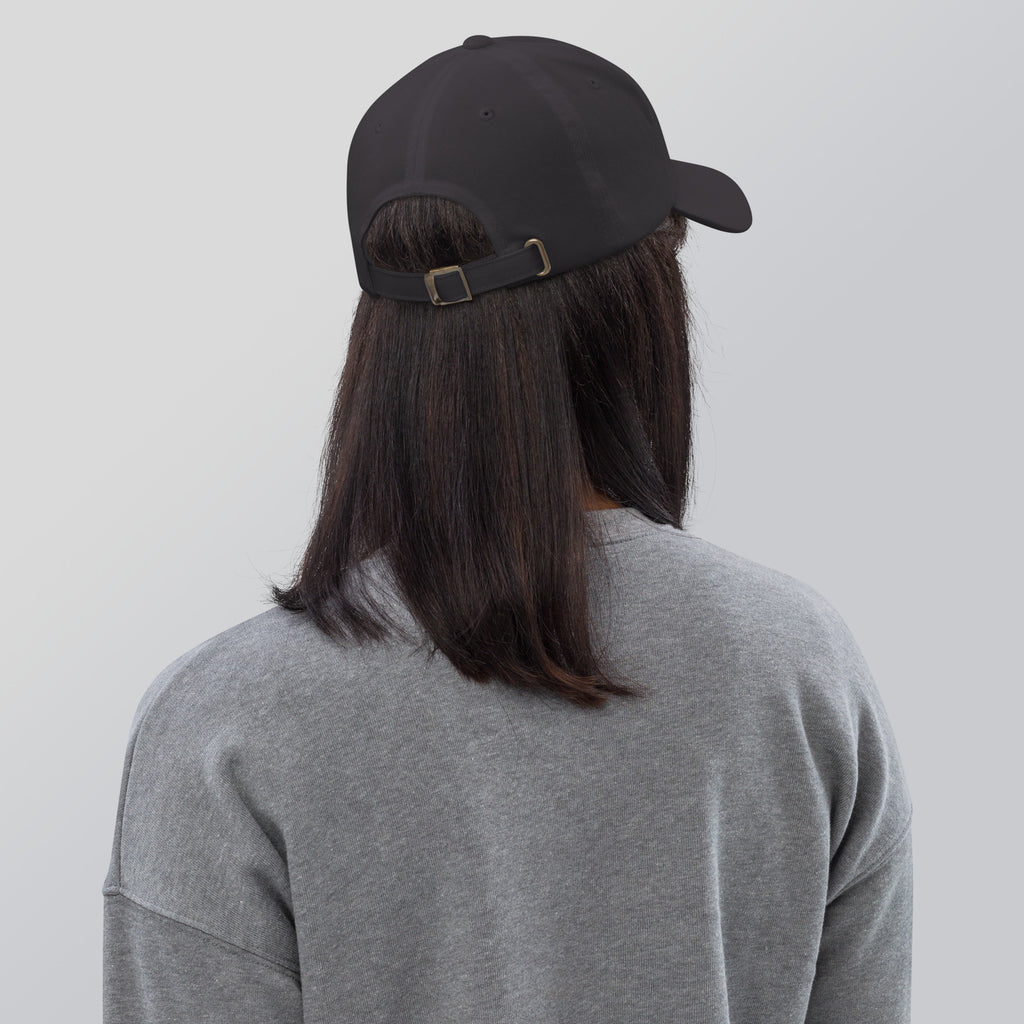Black dad hat embroidered with the word ‘HAG’ in ornate vintage gothic lettering. Alternative fashion accessory with queer streetwear aesthetic, witchy fashion, sarcastic humor, feminist style, indie fashion, spooky cute apparel, gothic embroidery, punk inspired streetwear, adjustable baseball cap, casual everyday alternative outfit, internet humor fashion, artsy accessory, and edgy statement hat for concerts, festivals, casual wear, and alternative wardrobes.