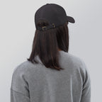 Black dad hat embroidered with the word ‘HAG’ in ornate vintage gothic lettering. Alternative fashion accessory with queer streetwear aesthetic, witchy fashion, sarcastic humor, feminist style, indie fashion, spooky cute apparel, gothic embroidery, punk inspired streetwear, adjustable baseball cap, casual everyday alternative outfit, internet humor fashion, artsy accessory, and edgy statement hat for concerts, festivals, casual wear, and alternative wardrobes.