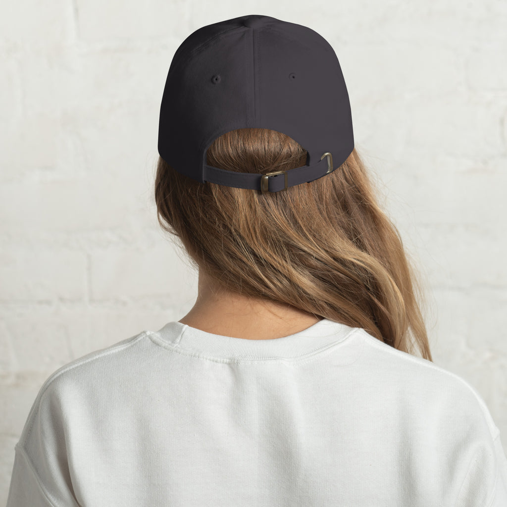 Black dad hat embroidered with the word ‘HAG’ in ornate vintage gothic lettering. Alternative fashion accessory with queer streetwear aesthetic, witchy fashion, sarcastic humor, feminist style, indie fashion, spooky cute apparel, gothic embroidery, punk inspired streetwear, adjustable baseball cap, casual everyday alternative outfit, internet humor fashion, artsy accessory, and edgy statement hat for concerts, festivals, casual wear, and alternative wardrobes.