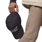 Baseball cap embroidered with the phrase ‘I Have a Cigarette in All 7 Holes’ in ornate vintage gothic lettering. Alternative fashion accessory with edgy internet humor, queer streetwear aesthetic, punk inspired style, ironic meme fashion, tattoo inspired typography, goth streetwear, adjustable dad hat, casual alternative outfit accessory, artsy statement cap, chaotic humor apparel, indie fashion, and expressive alternative clothing for concerts, festivals, everyday wear, and alternative wardrobes.