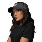 Black dad hat embroidered with the word ‘HAG’ in ornate vintage gothic lettering. Alternative fashion accessory with queer streetwear aesthetic, witchy fashion, sarcastic humor, feminist style, indie fashion, spooky cute apparel, gothic embroidery, punk inspired streetwear, adjustable baseball cap, casual everyday alternative outfit, internet humor fashion, artsy accessory, and edgy statement hat for concerts, festivals, casual wear, and alternative wardrobes.