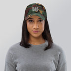 Black dad hat embroidered with the word ‘HAG’ in ornate vintage gothic lettering. Alternative fashion accessory with queer streetwear aesthetic, witchy fashion, sarcastic humor, feminist style, indie fashion, spooky cute apparel, gothic embroidery, punk inspired streetwear, adjustable baseball cap, casual everyday alternative outfit, internet humor fashion, artsy accessory, and edgy statement hat for concerts, festivals, casual wear, and alternative wardrobes.