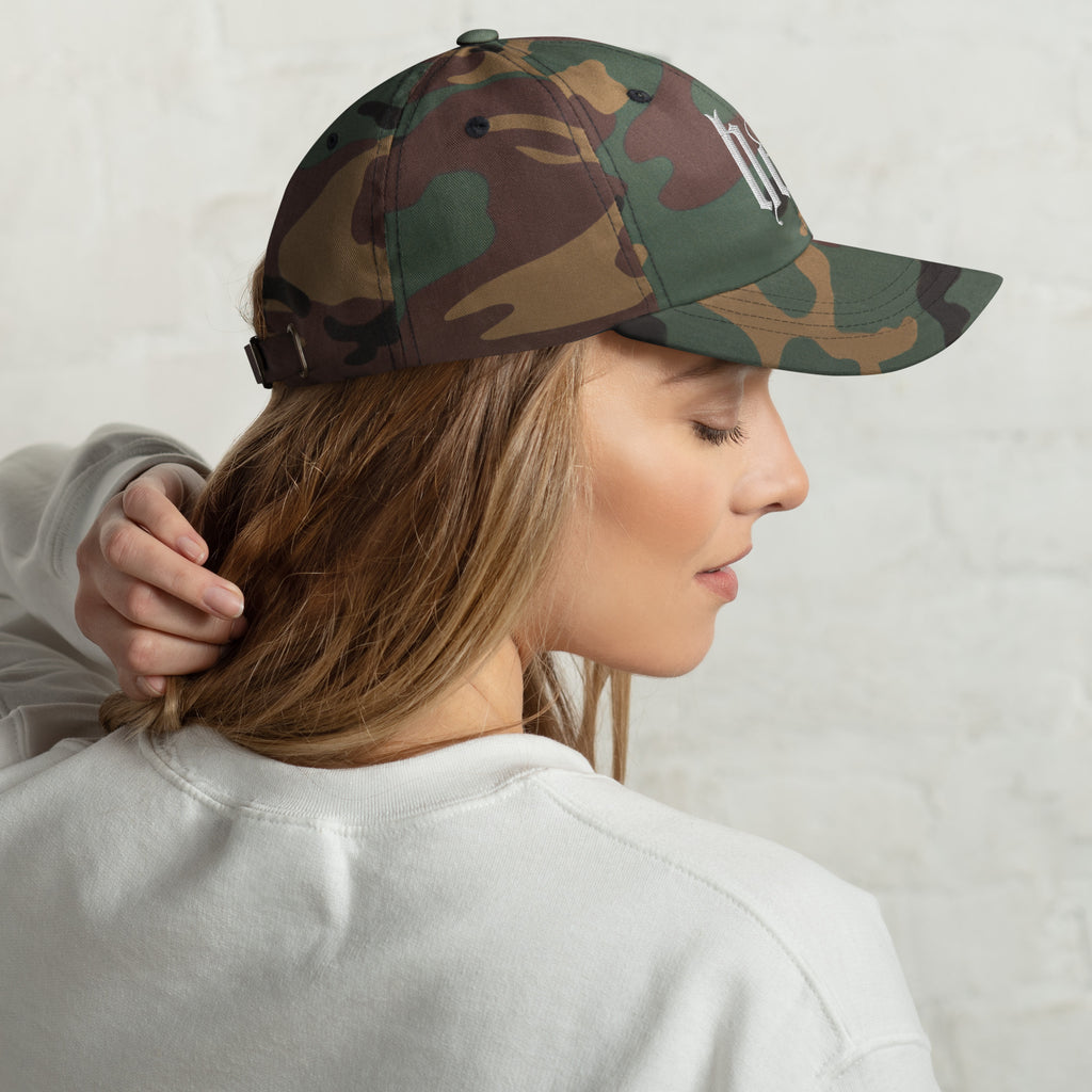 Black dad hat embroidered with the word ‘HAG’ in ornate vintage gothic lettering. Alternative fashion accessory with queer streetwear aesthetic, witchy fashion, sarcastic humor, feminist style, indie fashion, spooky cute apparel, gothic embroidery, punk inspired streetwear, adjustable baseball cap, casual everyday alternative outfit, internet humor fashion, artsy accessory, and edgy statement hat for concerts, festivals, casual wear, and alternative wardrobes.