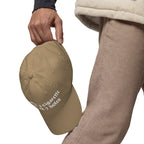 Baseball cap embroidered with the phrase ‘I Have a Cigarette in All 7 Holes’ in ornate vintage gothic lettering. Alternative fashion accessory with edgy internet humor, queer streetwear aesthetic, punk inspired style, ironic meme fashion, tattoo inspired typography, goth streetwear, adjustable dad hat, casual alternative outfit accessory, artsy statement cap, chaotic humor apparel, indie fashion, and expressive alternative clothing for concerts, festivals, everyday wear, and alternative wardrobes.