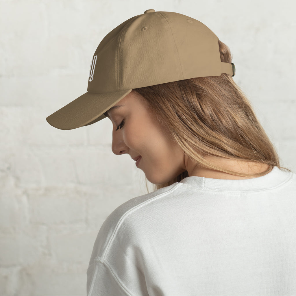 Black dad hat embroidered with the word ‘HAG’ in ornate vintage gothic lettering. Alternative fashion accessory with queer streetwear aesthetic, witchy fashion, sarcastic humor, feminist style, indie fashion, spooky cute apparel, gothic embroidery, punk inspired streetwear, adjustable baseball cap, casual everyday alternative outfit, internet humor fashion, artsy accessory, and edgy statement hat for concerts, festivals, casual wear, and alternative wardrobes.
