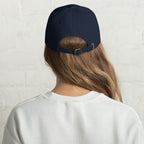 Black dad hat embroidered with the word ‘HAG’ in ornate vintage gothic lettering. Alternative fashion accessory with queer streetwear aesthetic, witchy fashion, sarcastic humor, feminist style, indie fashion, spooky cute apparel, gothic embroidery, punk inspired streetwear, adjustable baseball cap, casual everyday alternative outfit, internet humor fashion, artsy accessory, and edgy statement hat for concerts, festivals, casual wear, and alternative wardrobes.