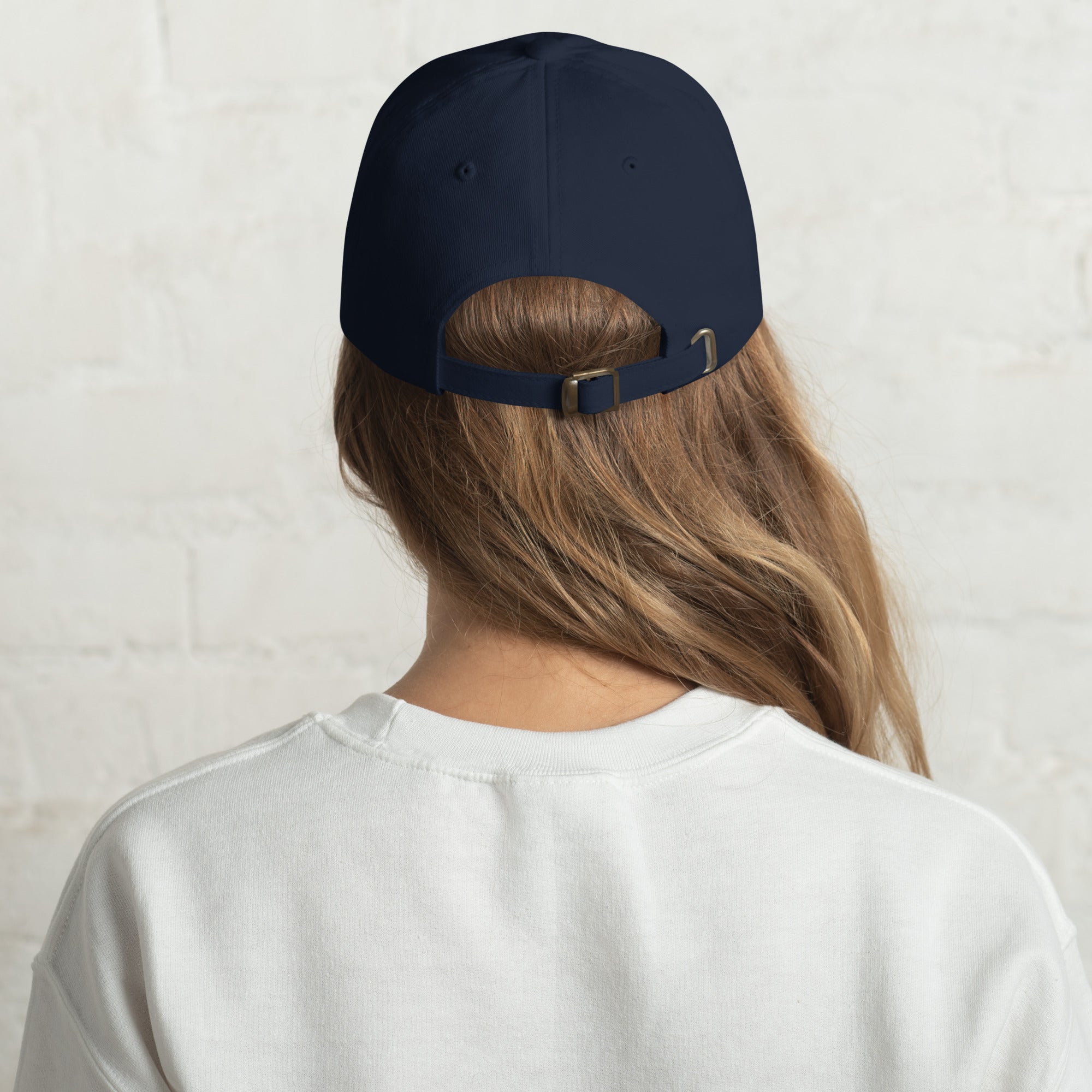 Black dad hat embroidered with the word ‘HAG’ in ornate vintage gothic lettering. Alternative fashion accessory with queer streetwear aesthetic, witchy fashion, sarcastic humor, feminist style, indie fashion, spooky cute apparel, gothic embroidery, punk inspired streetwear, adjustable baseball cap, casual everyday alternative outfit, internet humor fashion, artsy accessory, and edgy statement hat for concerts, festivals, casual wear, and alternative wardrobes.