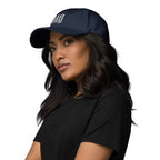 Black dad hat embroidered with the word ‘HAG’ in ornate vintage gothic lettering. Alternative fashion accessory with queer streetwear aesthetic, witchy fashion, sarcastic humor, feminist style, indie fashion, spooky cute apparel, gothic embroidery, punk inspired streetwear, adjustable baseball cap, casual everyday alternative outfit, internet humor fashion, artsy accessory, and edgy statement hat for concerts, festivals, casual wear, and alternative wardrobes.