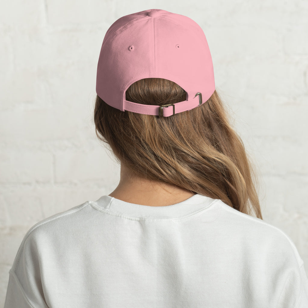 Baseball cap embroidered with the phrase ‘I Have a Cigarette in All 7 Holes’ in ornate vintage gothic lettering. Alternative fashion accessory with edgy internet humor, queer streetwear aesthetic, punk inspired style, ironic meme fashion, tattoo inspired typography, goth streetwear, adjustable dad hat, casual alternative outfit accessory, artsy statement cap, chaotic humor apparel, indie fashion, and expressive alternative clothing for concerts, festivals, everyday wear, and alternative wardrobes.