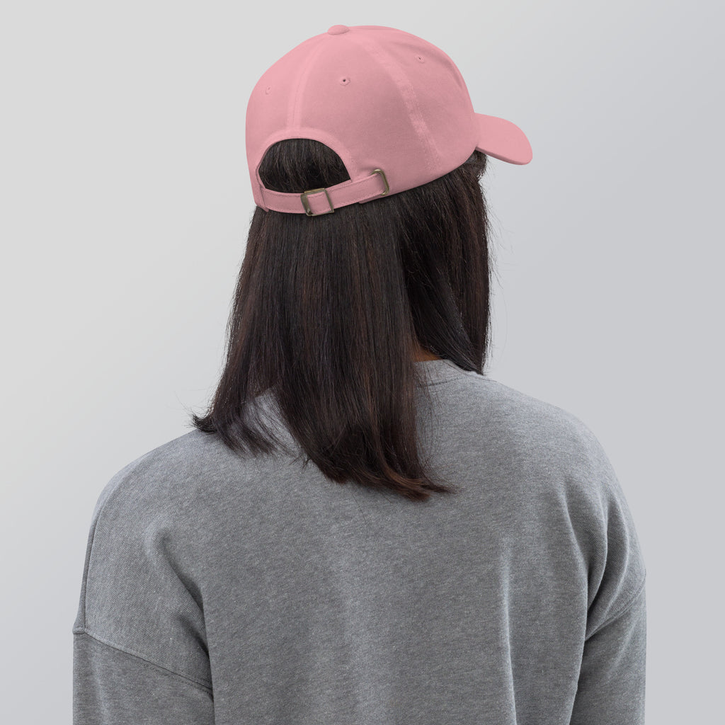 Black dad hat embroidered with the word ‘HAG’ in ornate vintage gothic lettering. Alternative fashion accessory with queer streetwear aesthetic, witchy fashion, sarcastic humor, feminist style, indie fashion, spooky cute apparel, gothic embroidery, punk inspired streetwear, adjustable baseball cap, casual everyday alternative outfit, internet humor fashion, artsy accessory, and edgy statement hat for concerts, festivals, casual wear, and alternative wardrobes.