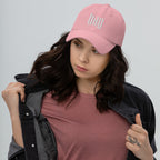 Black dad hat embroidered with the word ‘HAG’ in ornate vintage gothic lettering. Alternative fashion accessory with queer streetwear aesthetic, witchy fashion, sarcastic humor, feminist style, indie fashion, spooky cute apparel, gothic embroidery, punk inspired streetwear, adjustable baseball cap, casual everyday alternative outfit, internet humor fashion, artsy accessory, and edgy statement hat for concerts, festivals, casual wear, and alternative wardrobes.