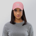 Black dad hat embroidered with the word ‘HAG’ in ornate vintage gothic lettering. Alternative fashion accessory with queer streetwear aesthetic, witchy fashion, sarcastic humor, feminist style, indie fashion, spooky cute apparel, gothic embroidery, punk inspired streetwear, adjustable baseball cap, casual everyday alternative outfit, internet humor fashion, artsy accessory, and edgy statement hat for concerts, festivals, casual wear, and alternative wardrobes.