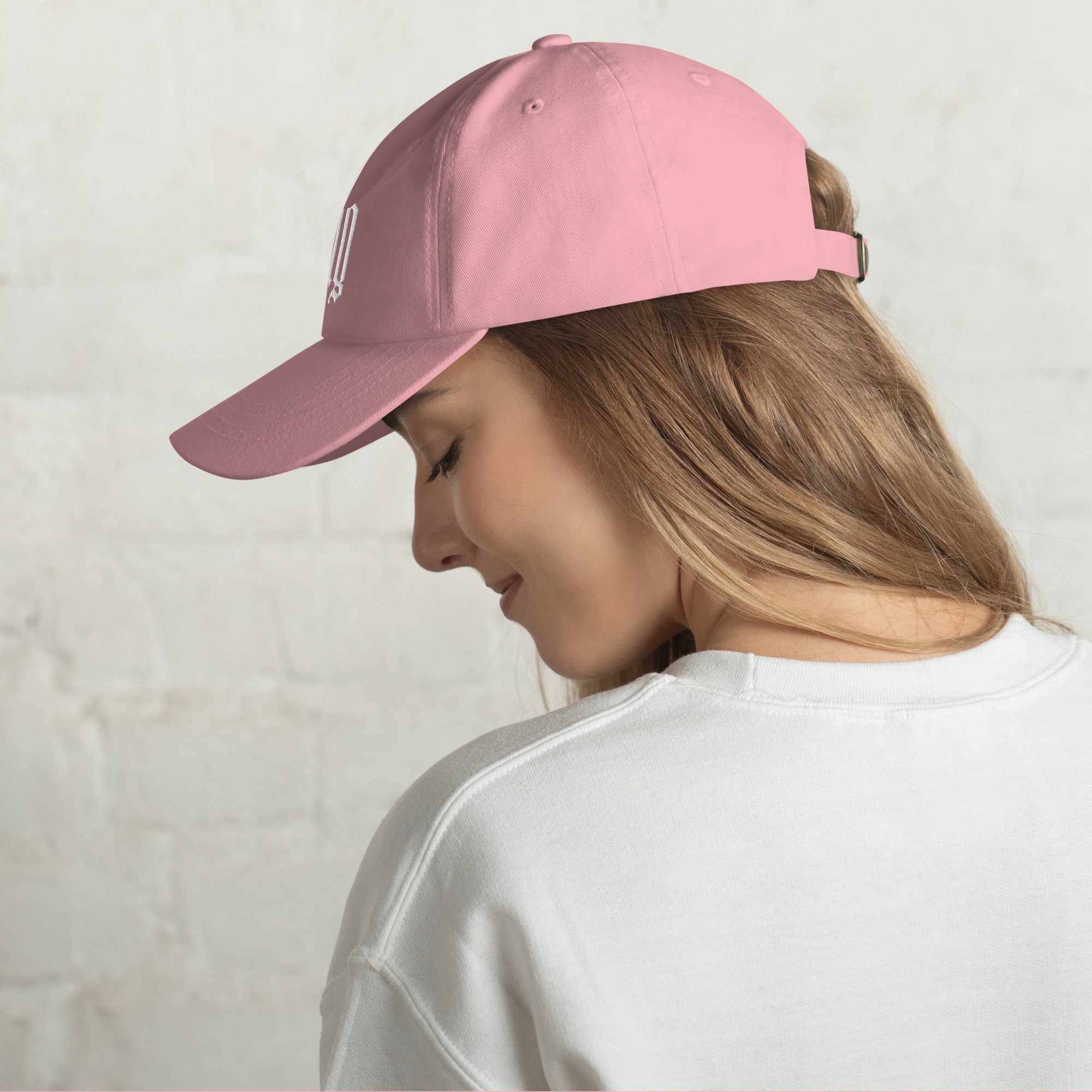 Black dad hat embroidered with the word ‘HAG’ in ornate vintage gothic lettering. Alternative fashion accessory with queer streetwear aesthetic, witchy fashion, sarcastic humor, feminist style, indie fashion, spooky cute apparel, gothic embroidery, punk inspired streetwear, adjustable baseball cap, casual everyday alternative outfit, internet humor fashion, artsy accessory, and edgy statement hat for concerts, festivals, casual wear, and alternative wardrobes.