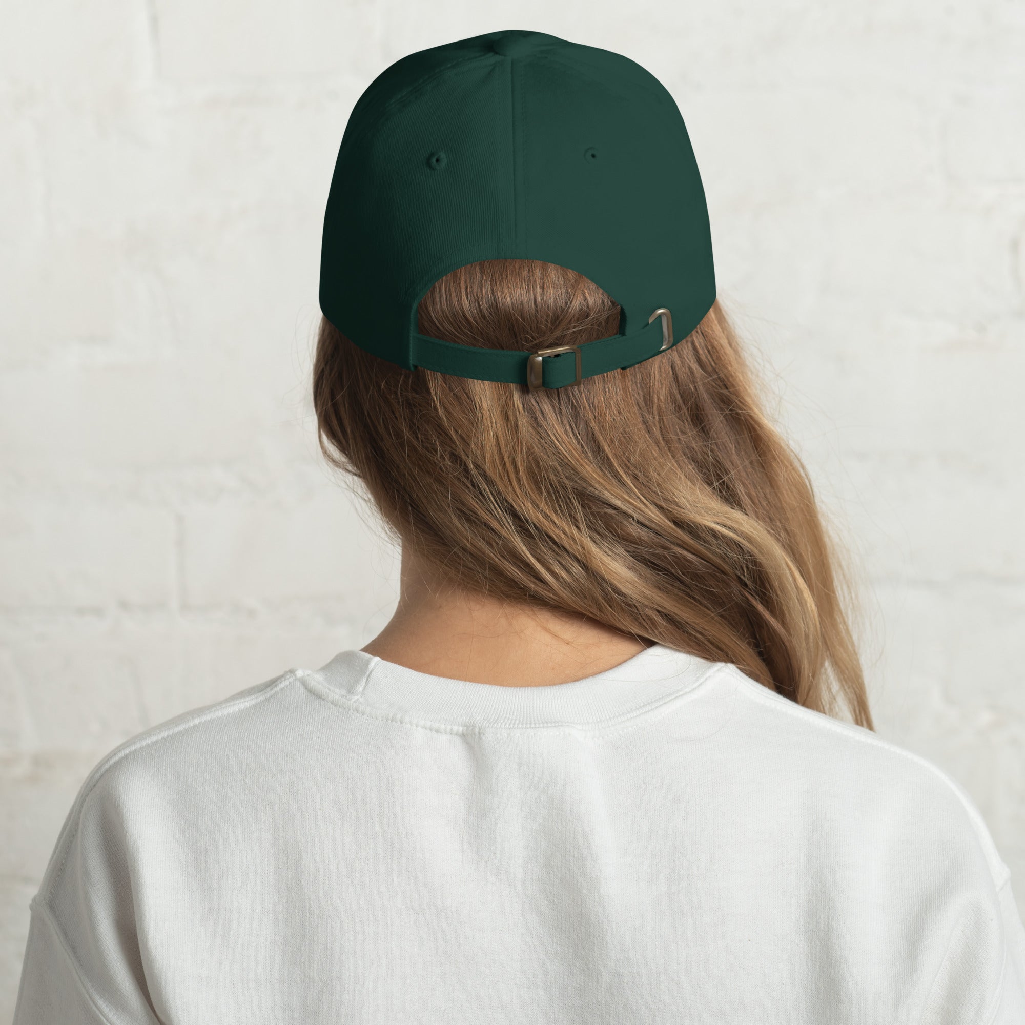 Black dad hat embroidered with the word ‘HAG’ in ornate vintage gothic lettering. Alternative fashion accessory with queer streetwear aesthetic, witchy fashion, sarcastic humor, feminist style, indie fashion, spooky cute apparel, gothic embroidery, punk inspired streetwear, adjustable baseball cap, casual everyday alternative outfit, internet humor fashion, artsy accessory, and edgy statement hat for concerts, festivals, casual wear, and alternative wardrobes.
