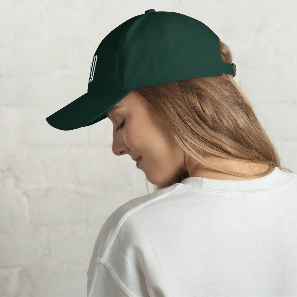 Black dad hat embroidered with the word ‘HAG’ in ornate vintage gothic lettering. Alternative fashion accessory with queer streetwear aesthetic, witchy fashion, sarcastic humor, feminist style, indie fashion, spooky cute apparel, gothic embroidery, punk inspired streetwear, adjustable baseball cap, casual everyday alternative outfit, internet humor fashion, artsy accessory, and edgy statement hat for concerts, festivals, casual wear, and alternative wardrobes.