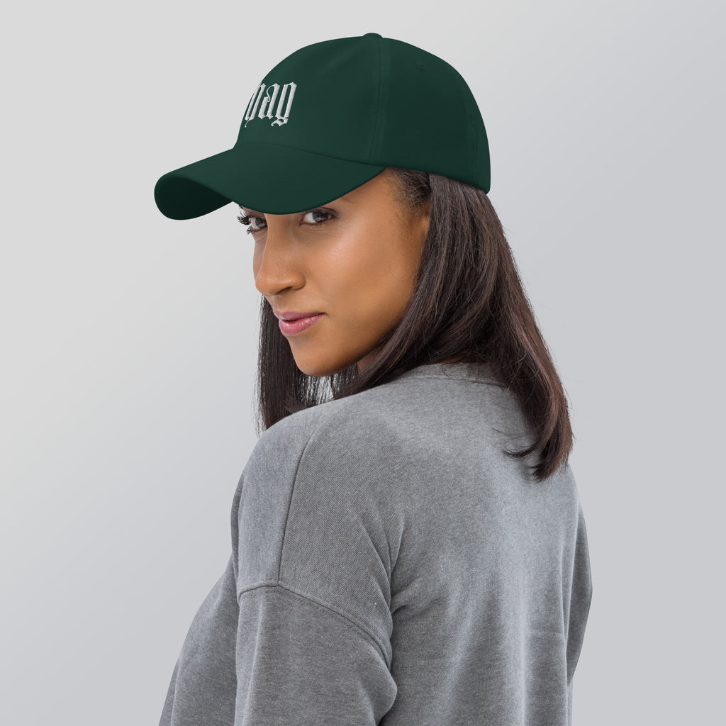 Black dad hat embroidered with the word ‘HAG’ in ornate vintage gothic lettering. Alternative fashion accessory with queer streetwear aesthetic, witchy fashion, sarcastic humor, feminist style, indie fashion, spooky cute apparel, gothic embroidery, punk inspired streetwear, adjustable baseball cap, casual everyday alternative outfit, internet humor fashion, artsy accessory, and edgy statement hat for concerts, festivals, casual wear, and alternative wardrobes.