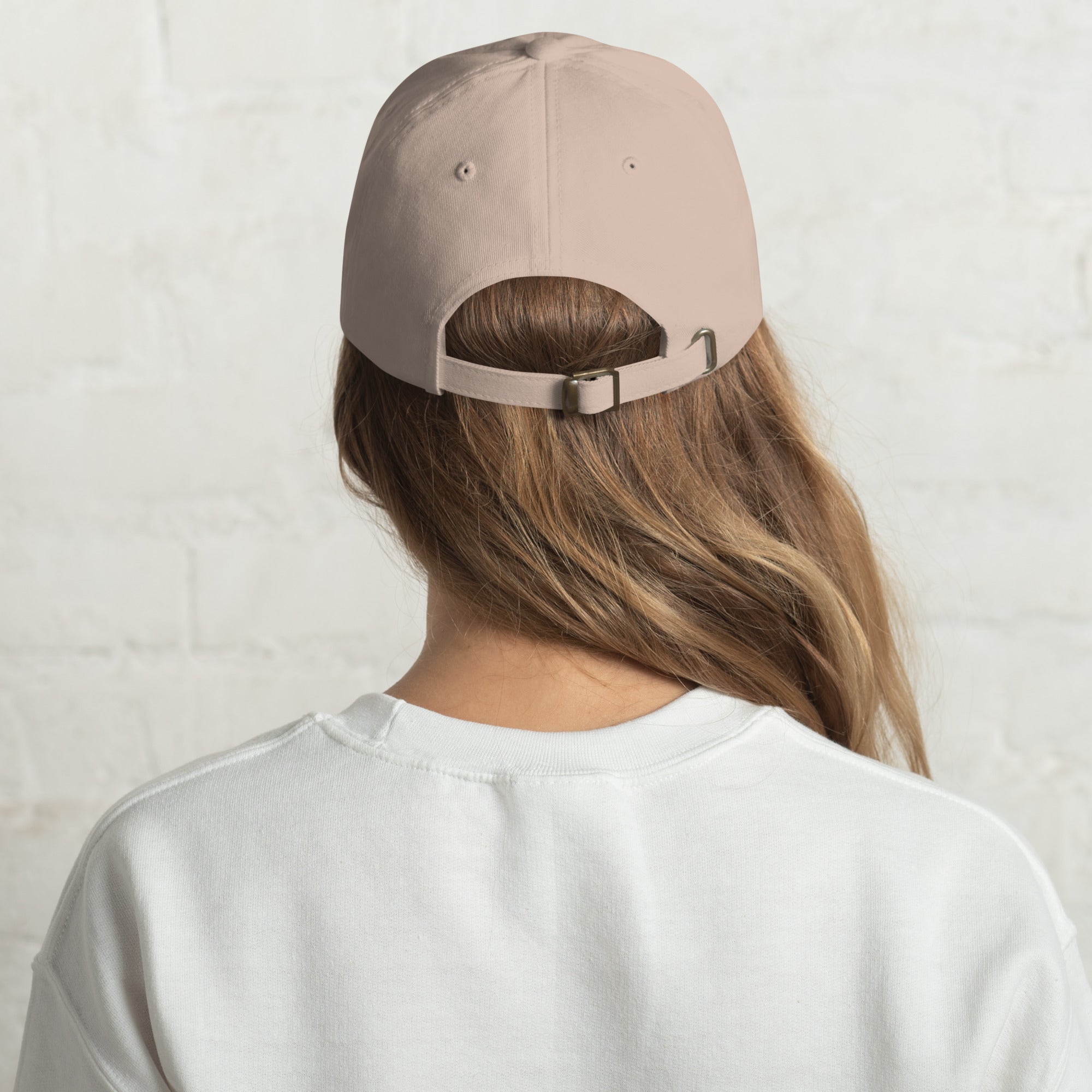 Baseball cap embroidered with the phrase ‘I Have a Cigarette in All 7 Holes’ in ornate vintage gothic lettering. Alternative fashion accessory with edgy internet humor, queer streetwear aesthetic, punk inspired style, ironic meme fashion, tattoo inspired typography, goth streetwear, adjustable dad hat, casual alternative outfit accessory, artsy statement cap, chaotic humor apparel, indie fashion, and expressive alternative clothing for concerts, festivals, everyday wear, and alternative wardrobes.