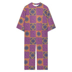 3/4 sleeve jumpsuit featuring the Petal Circuit in Disco Fig pattern with bold purple, pink, orange, and cream geometric floral shapes in a retro-inspired all-over print. Relaxed statement outfit with maximalist fashion aesthetic, indie streetwear, mod inspired design, expressive queer friendly fashion, artsy casualwear, colorful geometric artwork, and playful alternative clothing perfect for festivals, vacations, brunch, concerts, creative everyday wear, and bold summer outfits.