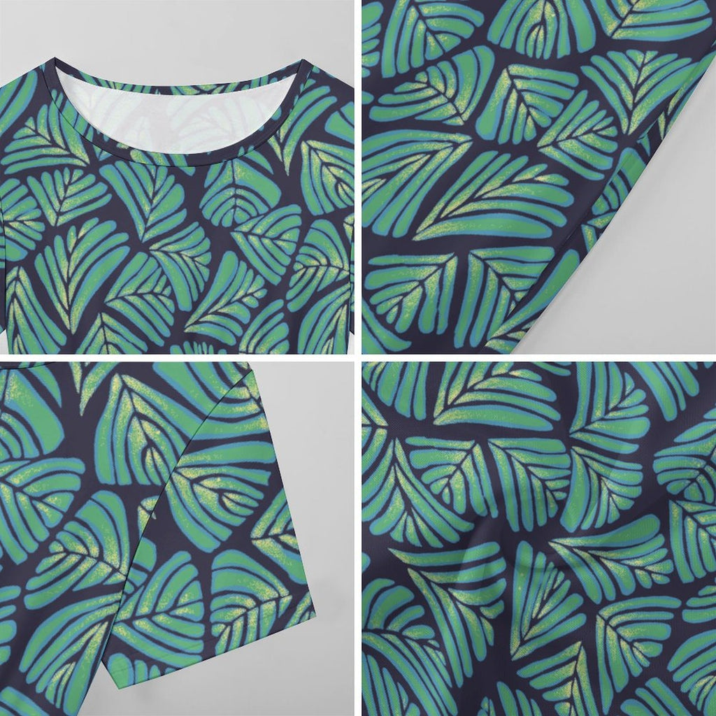 Short sleeve dress featuring the Frondescence pattern with layered tropical foliage in deep green botanical tones and an all-over nature-inspired print. Flowy casual dress with earthy jungle aesthetic, maximalist fashion, indie streetwear, botanical artwork, expressive queer friendly style, artsy everyday wear, and retro-inspired tropical clothing perfect for vacations, brunch, festivals, casual outings, and comfortable everyday alternative fashion.